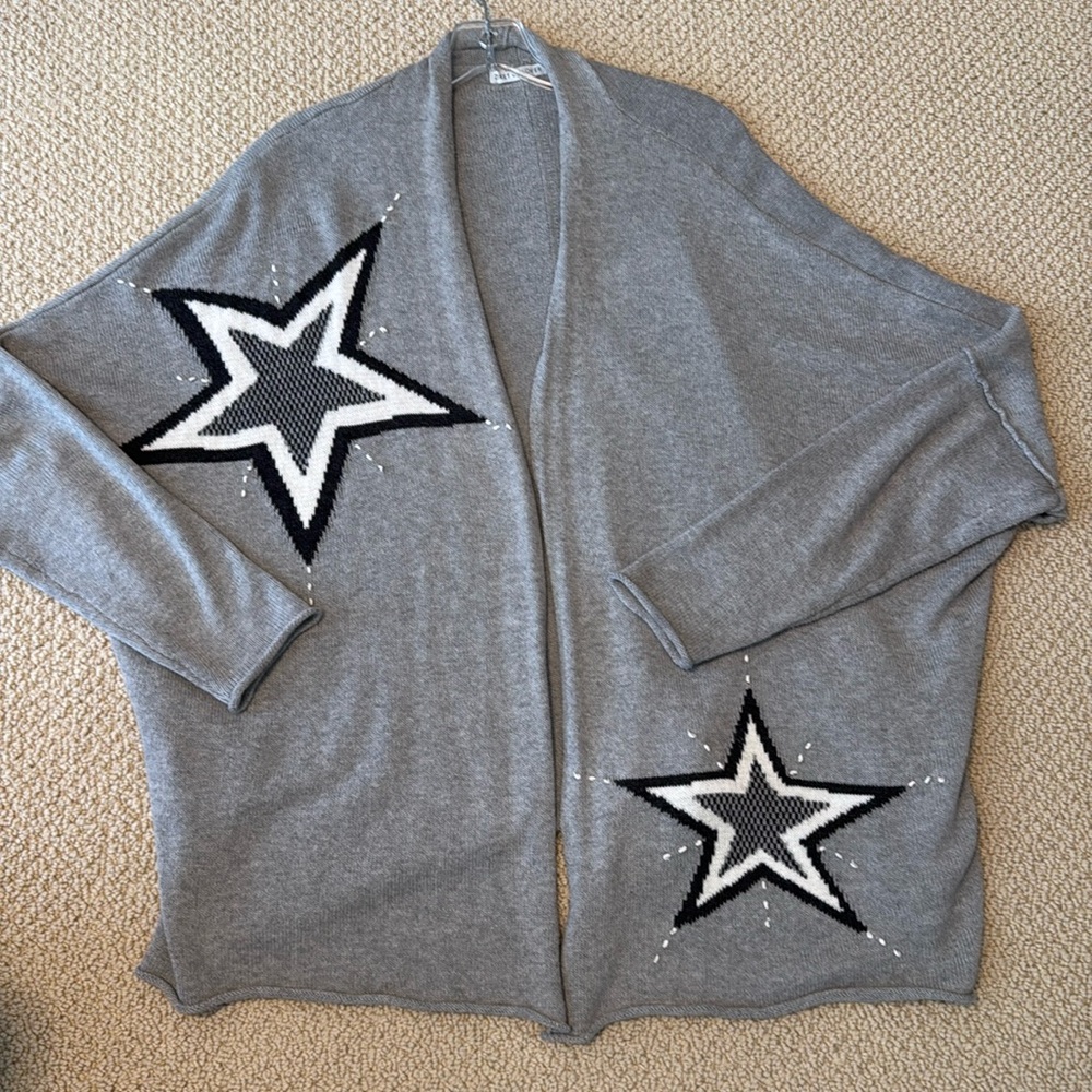 Adorable grey high low open cardigan sweater with black and white stars.